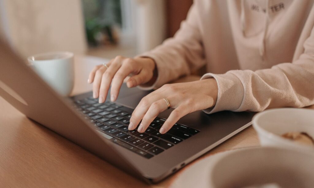 Women typing on laptop